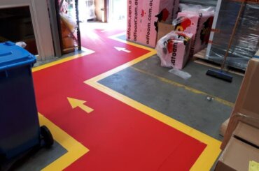 Arrow traffic flow floor painting