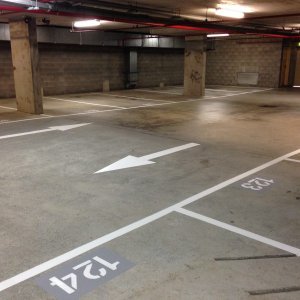 Parking bay with traffic flow arrows